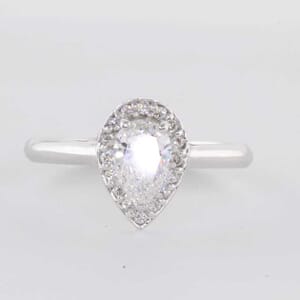 5411 - pear halo channel set engagement ring