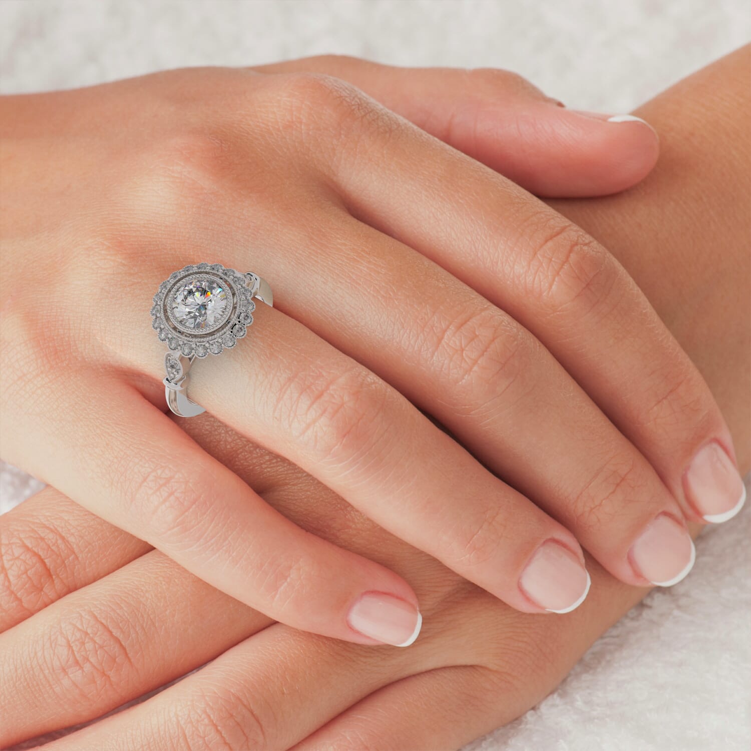 Delicate halo engagement ring top